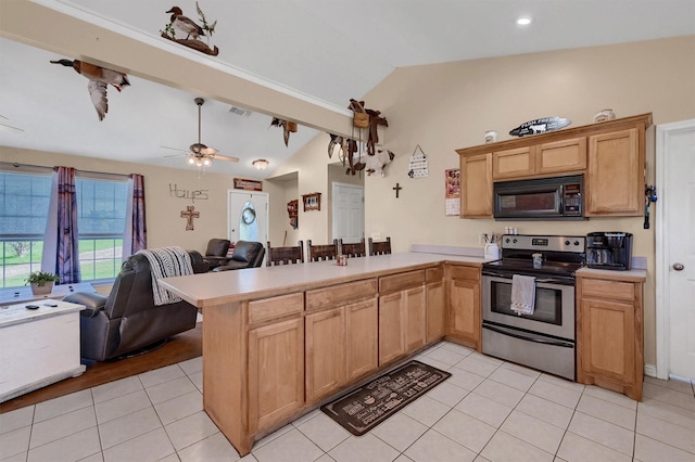 kitchen featuring black microwave, a peninsula, stainless steel electric range oven, vaulted ceiling, and open floor plan