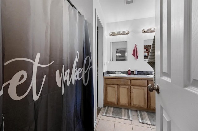 full bathroom with tile patterned floors, vanity, visible vents, and a shower with curtain