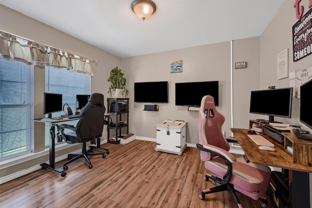 office area featuring baseboards and wood finished floors
