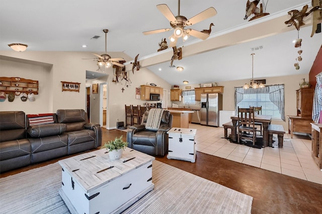 living area featuring visible vents, ceiling fan with notable chandelier, baseboards, and lofted ceiling