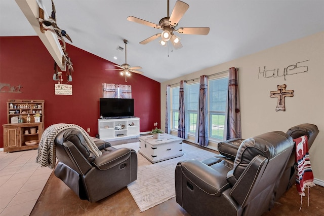 living room with ceiling fan, an accent wall, vaulted ceiling, tile patterned floors, and baseboards