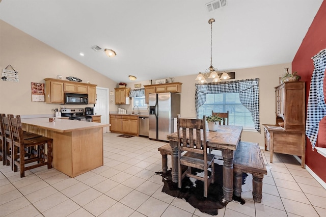 dining room featuring visible vents, lofted ceiling, a chandelier, and light tile patterned flooring