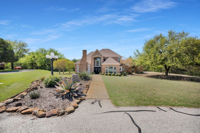 604 Valley View Ct, Ovilla, TX 75154 - french country home featuring a front lawn and stone siding