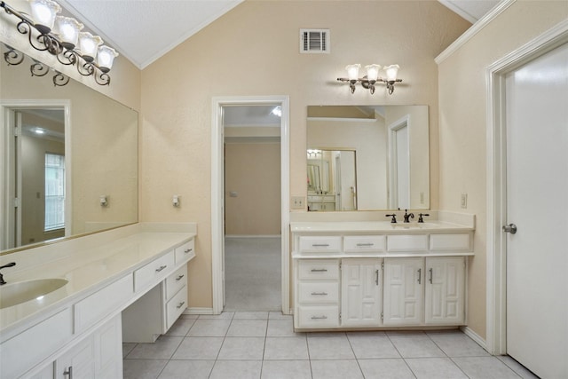 full bathroom with crown molding, two vanities, a sink, and lofted ceiling