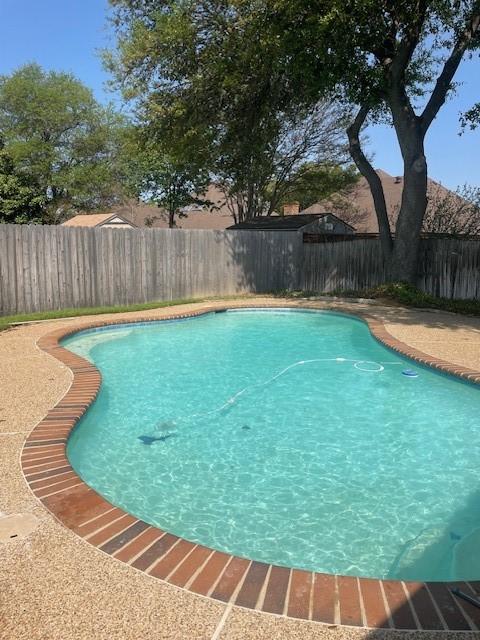 view of pool with a fenced backyard and a fenced in pool