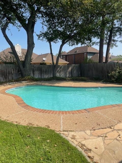 view of swimming pool with fence and a fenced in pool