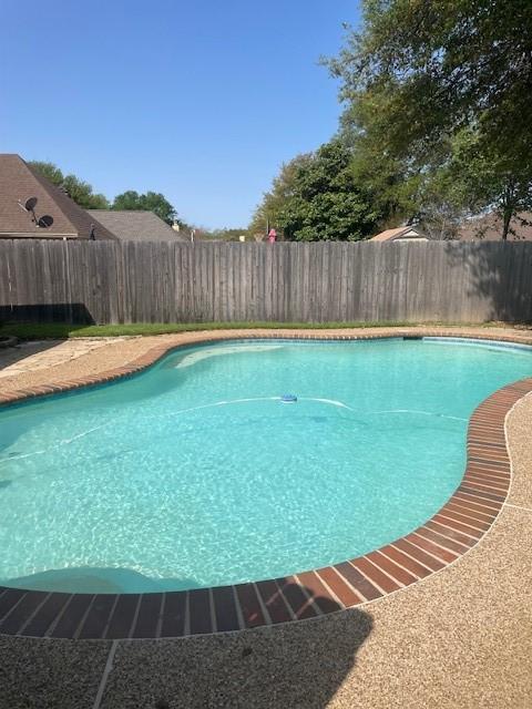 view of pool featuring a fenced backyard and a fenced in pool