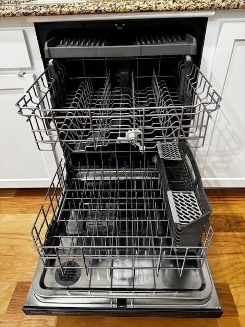 details with dishwasher and wood finished floors