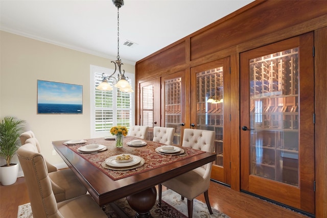 830 High Meadow Rd, Frisco, TX 75033 - entryway featuring baseboards, crown molding, wood finished floors, and a chandelier
