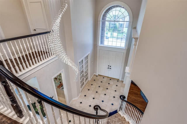 1417 Tree Farm Dr, Plano, TX 75093 - entrance foyer featuring a towering ceiling, stairway, and baseboards