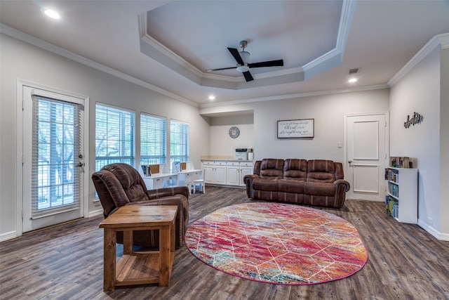 1417 Tree Farm Dr, Plano, TX 75093 - living area with ornamental molding, ceiling fan, a raised ceiling, dark wood-style flooring, and recessed lighting