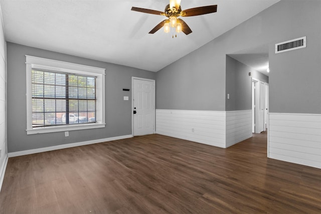 interior space with wood finished floors, vaulted ceiling, visible vents, and ceiling fan