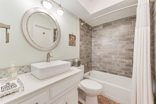 full bathroom with tile patterned floors, shower / tub combo with curtain, vanity, and toilet
