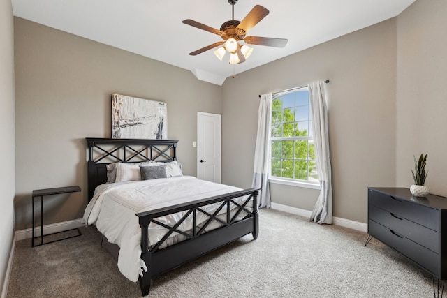 bedroom featuring baseboards, ceiling fan, light colored carpet, and lofted ceiling