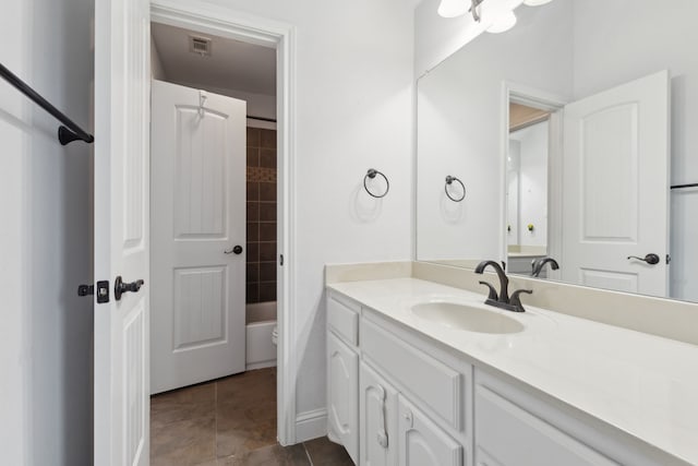 full bath featuring vanity, tile patterned floors, toilet, visible vents, and tub / shower combination