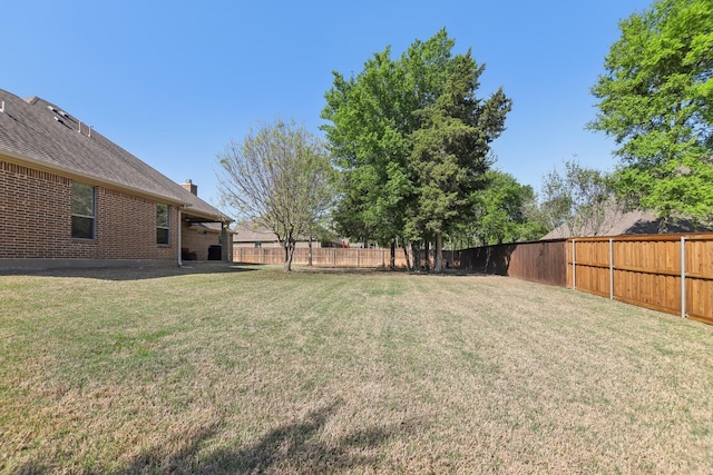 view of yard with a fenced backyard