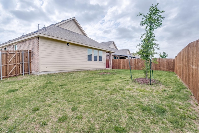 exterior space with a fenced backyard