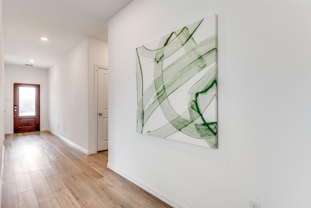 hall with recessed lighting, baseboards, and light wood-type flooring