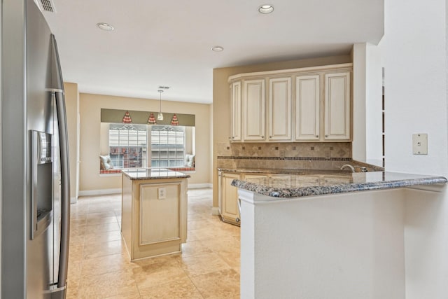 604 Nelson Ct, Plano, TX 75025 - kitchen featuring a peninsula, a kitchen island, stainless steel refrigerator with ice dispenser, cream cabinetry, and stone counters
