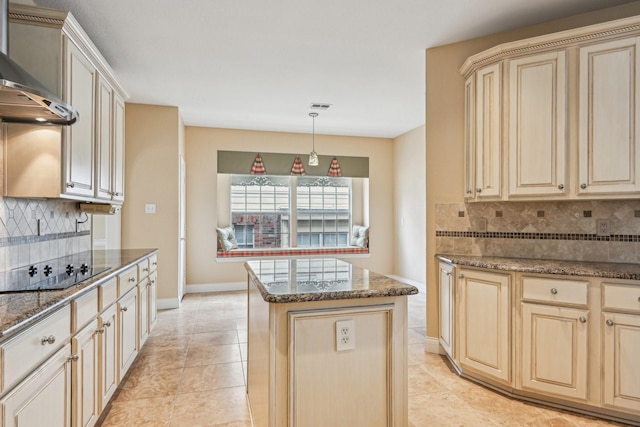 604 Nelson Ct, Plano, TX 75025 - kitchen with a center island, decorative backsplash, black electric stovetop, and wall chimney range hood