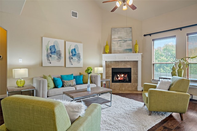 4134 Lee Hutson Dr, Sachse, TX 75048 - living room featuring a tile fireplace, ceiling fan, visible vents, and wood finished floors