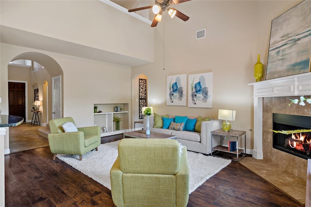 4134 Lee Hutson Dr, Sachse, TX 75048 - living area with dark wood finished floors, a ceiling fan, visible vents, and a tile fireplace