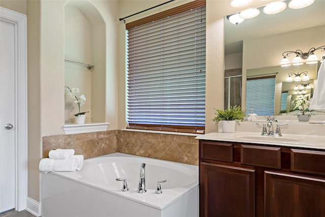4134 Lee Hutson Dr, Sachse, TX 75048 - bathroom featuring a shower with shower door, vanity, and a garden tub