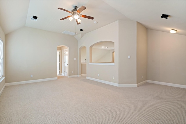 4134 Lee Hutson Dr, Sachse, TX 75048 - spare room featuring arched walkways, light colored carpet, a ceiling fan, lofted ceiling, and baseboards