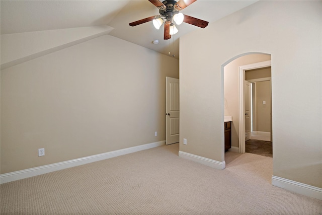 4134 Lee Hutson Dr, Sachse, TX 75048 - unfurnished bedroom featuring baseboards, arched walkways, ceiling fan, vaulted ceiling, and light carpet