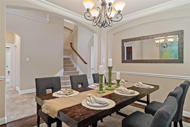 4134 Lee Hutson Dr, Sachse, TX 75048 - dining area with a chandelier, arched walkways, stairway, and ornamental molding