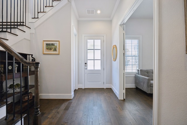 entryway featuring visible vents, baseboards, dark wood-type flooring, and stairway