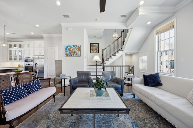 living room featuring visible vents, ornamental molding, a ceiling fan, and recessed lighting
