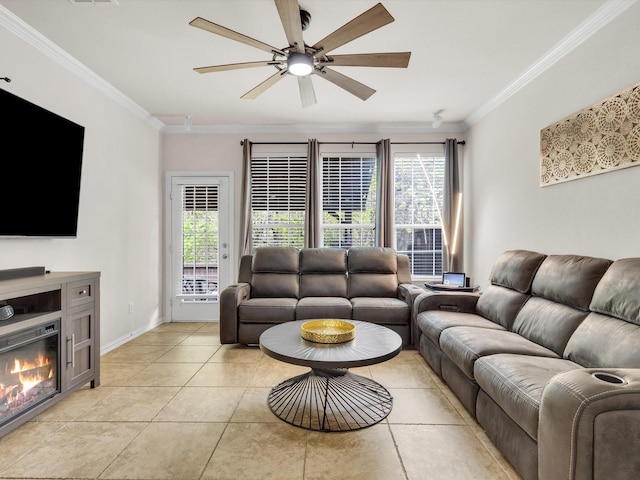 living room with a ceiling fan, light tile patterned floors, baseboards, and ornamental molding