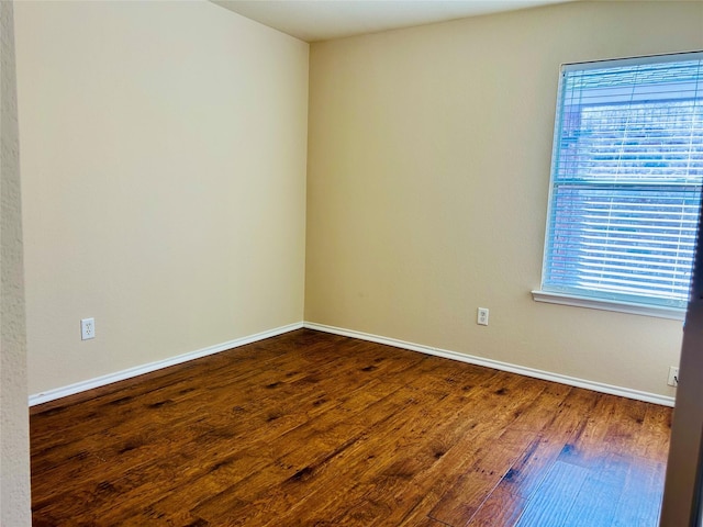 10425 Winding Passage Way, Fort Worth, TX 76131 - empty room with baseboards, a wealth of natural light, and wood finished floors