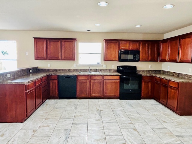 10425 Winding Passage Way, Fort Worth, TX 76131 - kitchen featuring a sink, a peninsula, black appliances, and a wealth of natural light