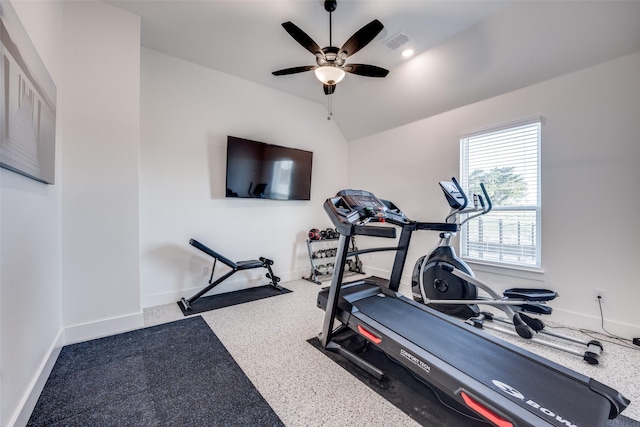 workout room with visible vents, baseboards, vaulted ceiling, and ceiling fan