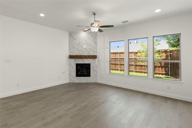 3811 Lochwood Dr, Rowlett, TX 75088 - unfurnished living room with a ceiling fan, wood finished floors, a fireplace, and recessed lighting
