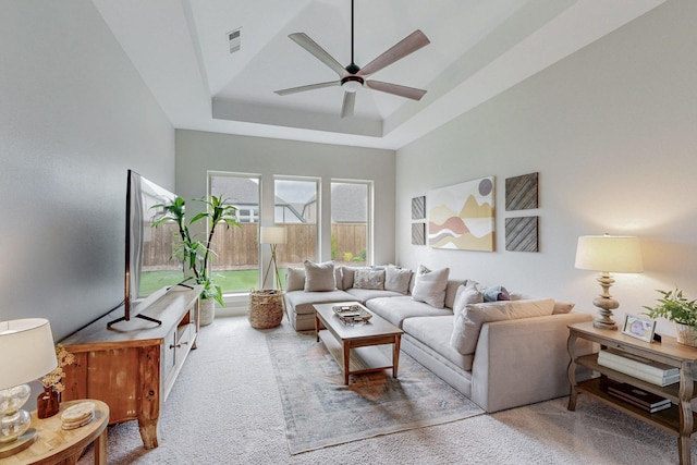2801 Capitol Pl, Melissa, TX 75454 - carpeted living room with ceiling fan, a tray ceiling, and visible vents