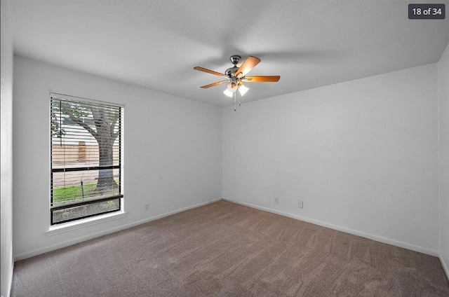 unfurnished room featuring baseboards, carpet, and ceiling fan