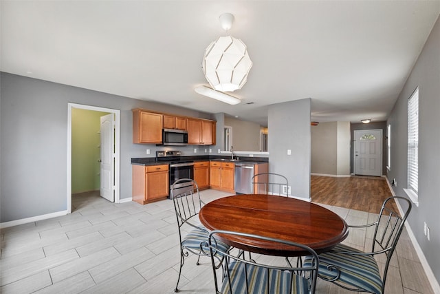 117 Independence Ave, Venus, TX 76084 - dining space featuring baseboards and light wood-style floors