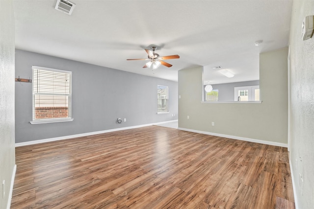 117 Independence Ave, Venus, TX 76084 - unfurnished room featuring a ceiling fan, wood finished floors, and baseboards