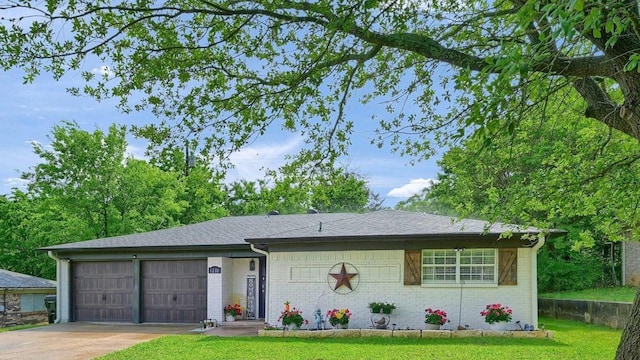 1210 Carla Dr, Denison, TX 75020 - view of front facade with a garage, driveway, a front yard, and brick siding