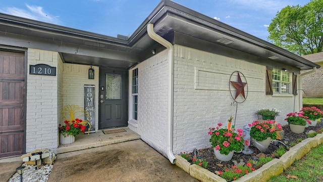 1210 Carla Dr, Denison, TX 75020 - doorway to property featuring brick siding