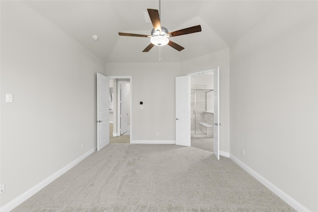 unfurnished bedroom with carpet, baseboards, a ceiling fan, and connected bathroom