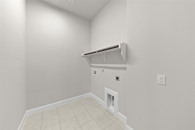 laundry area with laundry area, light tile patterned floors, hookup for a washing machine, hookup for an electric dryer, and gas dryer hookup