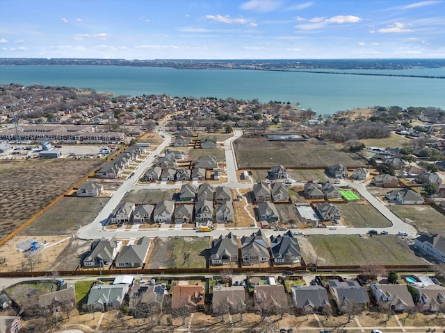 bird's eye view featuring a residential view and a water view