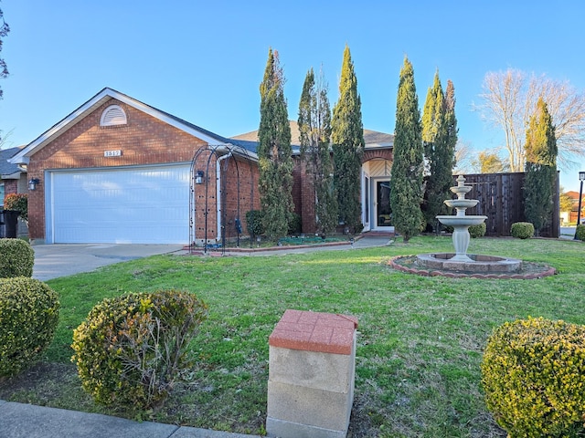 1317 Swiss Ct, Plano, TX 75023 - view of front of home with a garage, a front yard, brick siding, and driveway