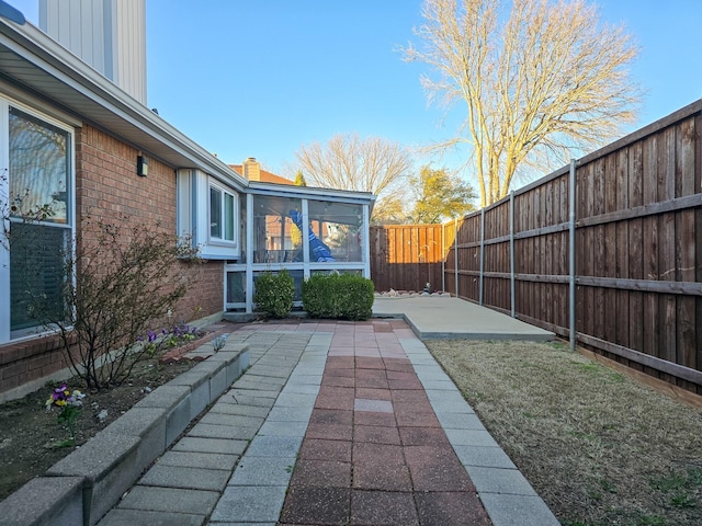 1317 Swiss Ct, Plano, TX 75023 - view of patio / terrace featuring a sunroom and a fenced backyard