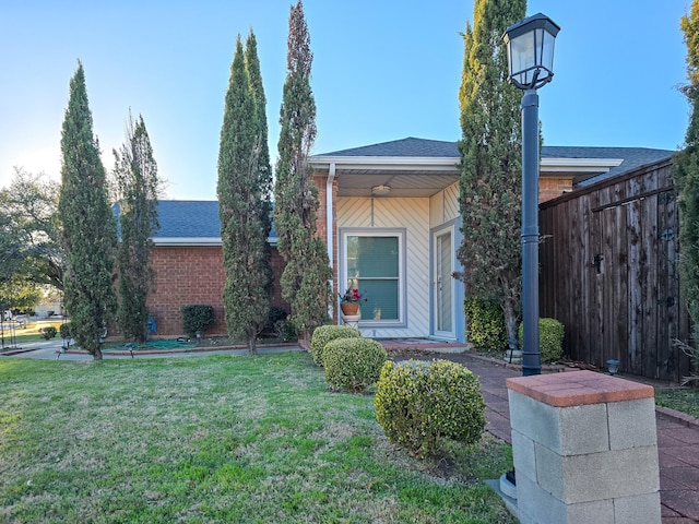 1317 Swiss Ct, Plano, TX 75023 - view of front of property with brick siding, a front yard, and roof with shingles