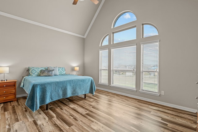 1109 Mount Ln, Rhome, TX 76078 - bedroom featuring ornamental molding, wood finished floors, high vaulted ceiling, ceiling fan, and baseboards